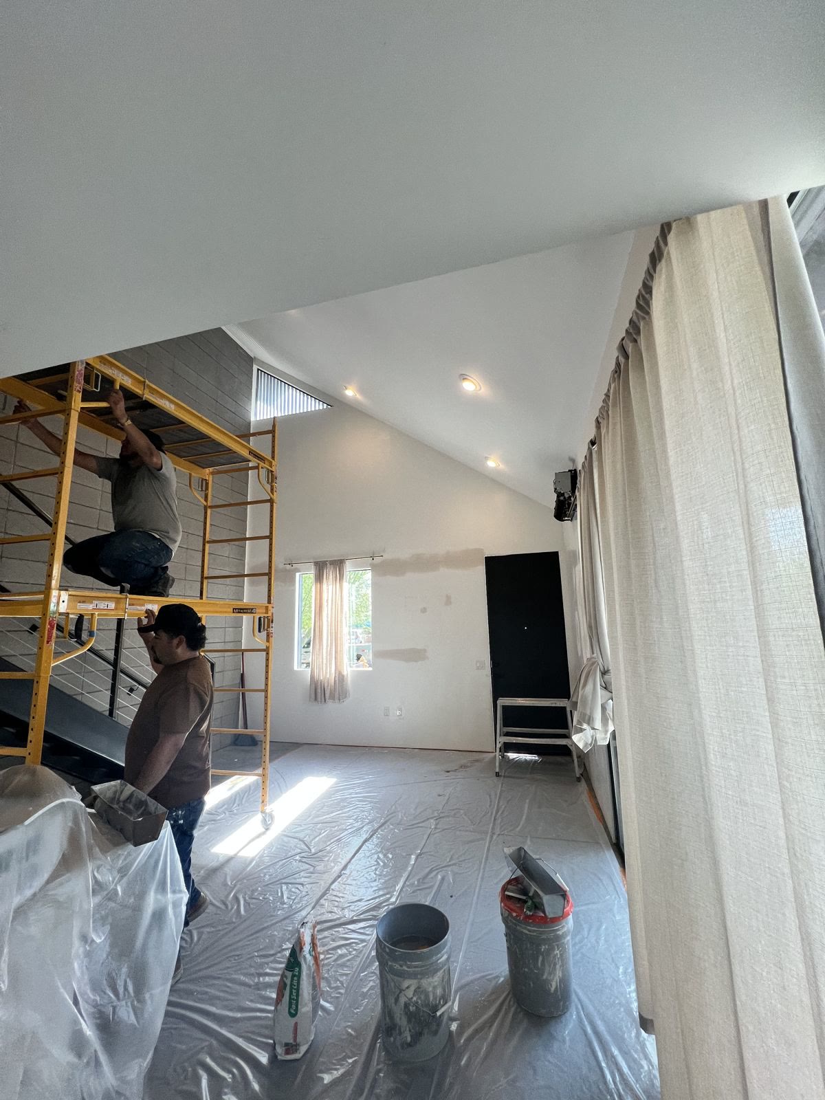 Shield Coat painter spraying an interior finish